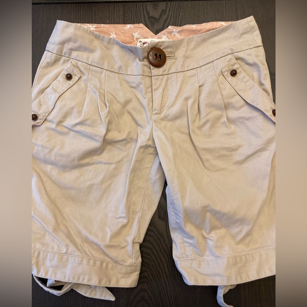 Trovata pleated Bermuda shorts with back hem ties